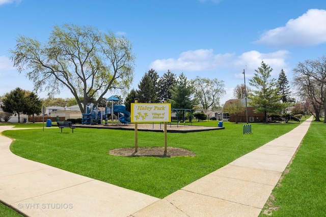 surrounding community featuring a lawn and playground community