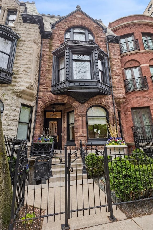 1242 N Astor St, Chicago, IL 60610 - townhome / multi-family property with a fenced front yard and a gate