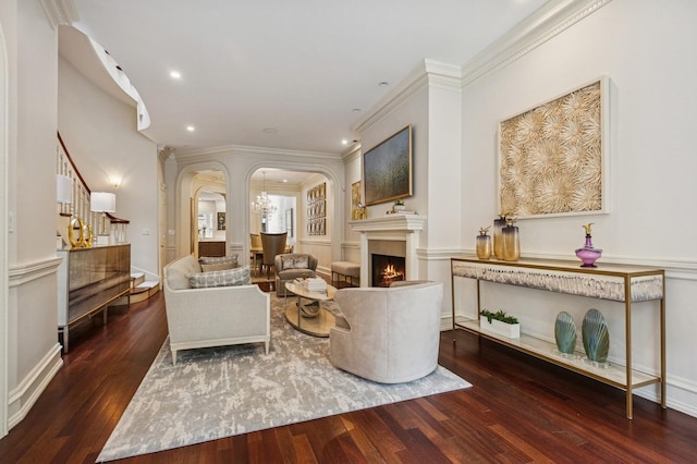 1242 N Astor St, Chicago, IL 60610 - living room with arched walkways, a warm lit fireplace, hardwood / wood-style floors, and recessed lighting