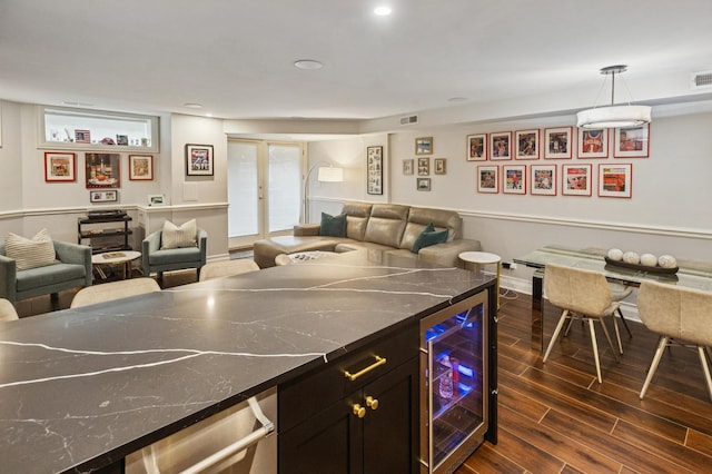 1242 N Astor St, Chicago, IL 60610 - interior space featuring wine cooler, visible vents, open floor plan, dark wood-style floors, and baseboards
