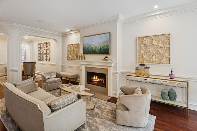 1242 N Astor St, Chicago, IL 60610 - living area with arched walkways, a fireplace with flush hearth, crown molding, and wood finished floors