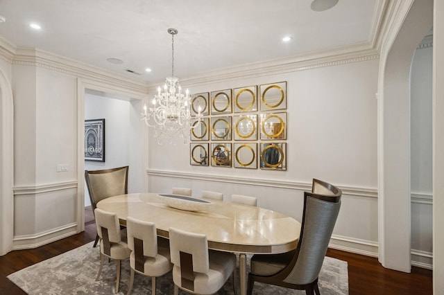 1242 N Astor St, Chicago, IL 60610 - dining space featuring an inviting chandelier, baseboards, arched walkways, and dark wood-style floors