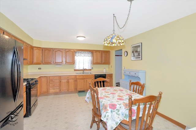 dining room with baseboards and light floors