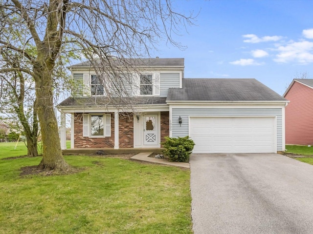 1005 Thomas Blvd, Mundelein, IL 60060 - traditional-style house with an attached garage, brick siding, a porch, a front yard, and driveway