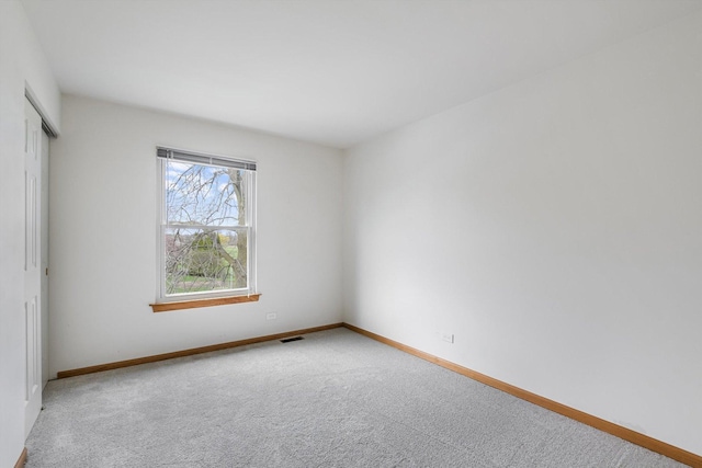 1005 Thomas Blvd, Mundelein, IL 60060 - empty room featuring baseboards, carpet, and visible vents