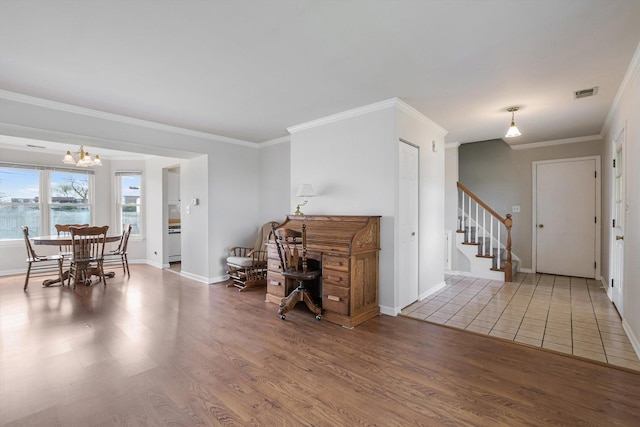1005 Thomas Blvd, Mundelein, IL 60060 - interior space featuring an inviting chandelier, stairway, wood finished floors, and visible vents