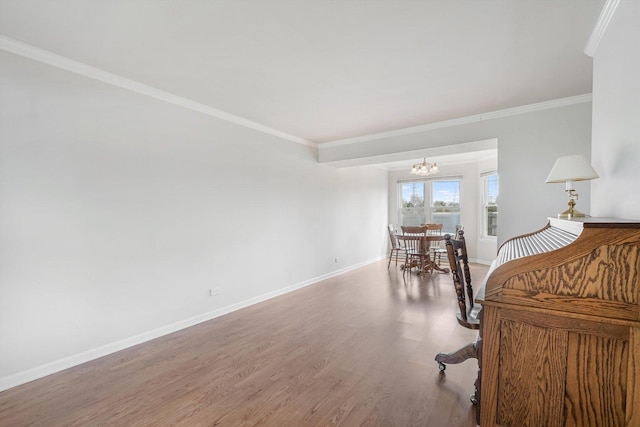 1005 Thomas Blvd, Mundelein, IL 60060 - interior space with baseboards, an inviting chandelier, ornamental molding, and wood finished floors