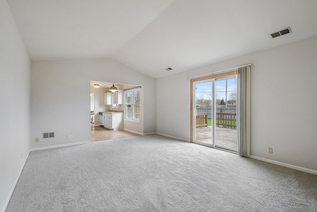 1005 Thomas Blvd, Mundelein, IL 60060 - interior space featuring light colored carpet, visible vents, access to exterior, and lofted ceiling