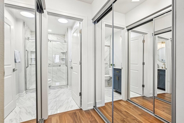 interior space with a sink and wood finished floors