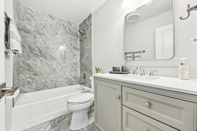 bathroom featuring vanity, shower / bathtub combination, toilet, and marble finish floor