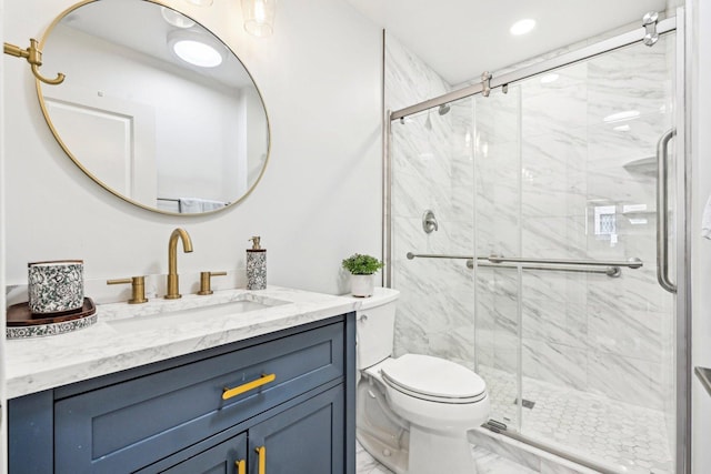full bath featuring vanity, toilet, a marble finish shower, and marble finish floor