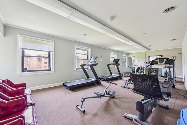 gym with baseboards, carpet, and visible vents