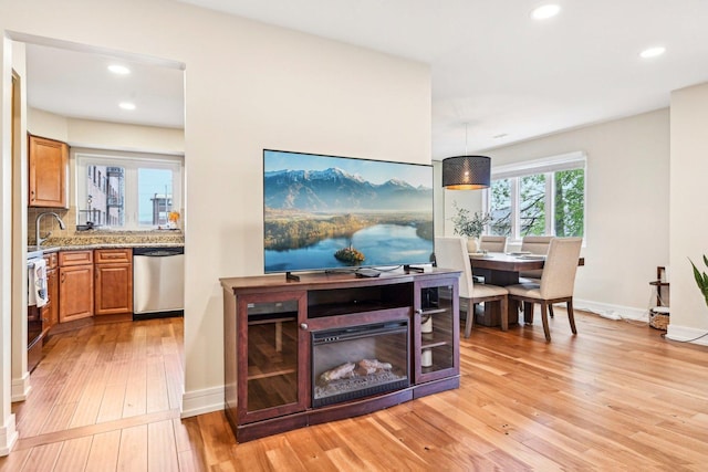 bar with recessed lighting, light wood-style floors, baseboards, and dishwasher