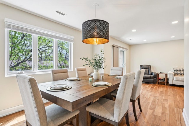 dining room featuring light wood-style floors, recessed lighting, and visible vents
