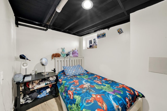 bedroom with wood finished floors