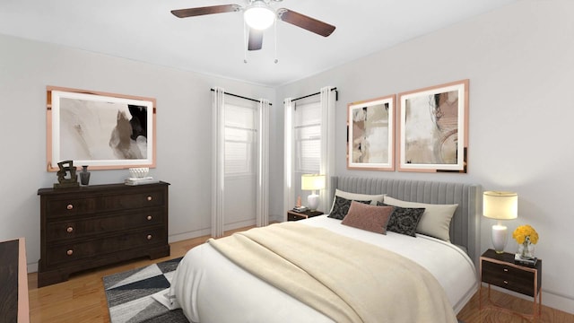 bedroom featuring a ceiling fan and wood finished floors