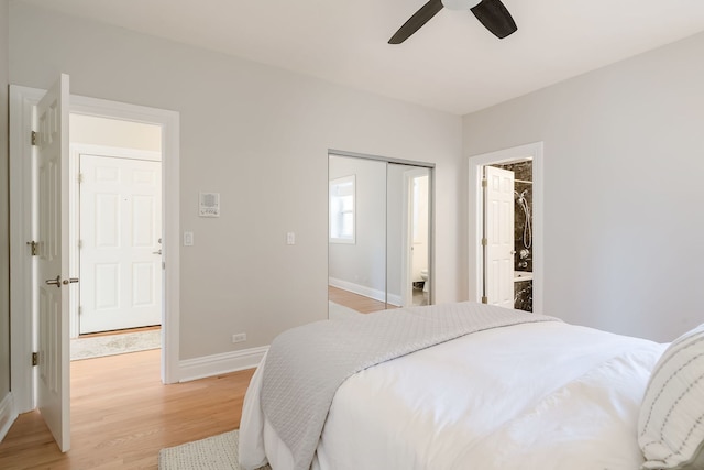 bedroom with light wood-style floors, baseboards, ceiling fan, and a closet