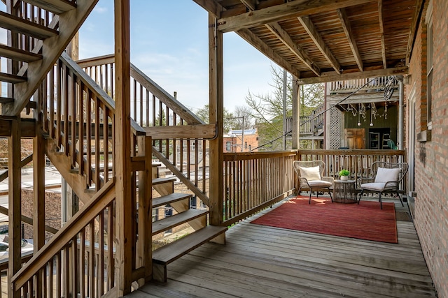 wooden deck featuring stairway