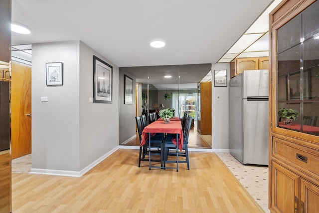5540 Walnut Ave Unit 22C, Downers Grove, IL 60515 - dining room featuring baseboards and light wood finished floors