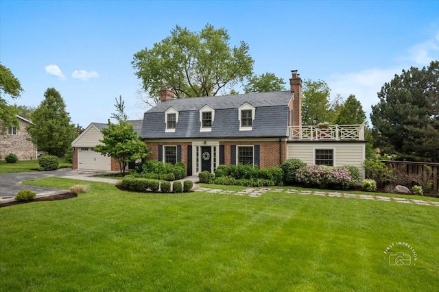 6N225 Circle Ave, Medinah, IL 60157 - colonial inspired home featuring brick siding, a chimney, a front yard, an attached garage, and driveway