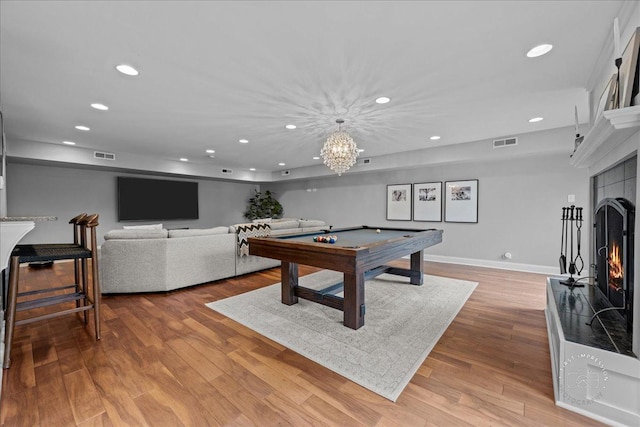 6N225 Circle Ave, Medinah, IL 60157 - rec room with recessed lighting, a lit fireplace, billiards, wood finished floors, and baseboards