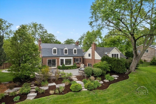 6N225 Circle Ave, Medinah, IL 60157 - view of front of property with brick siding, a patio, and a chimney