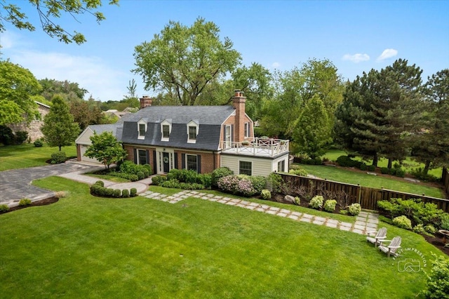 6N225 Circle Ave, Medinah, IL 60157 - colonial inspired home featuring a chimney, brick siding, and a balcony