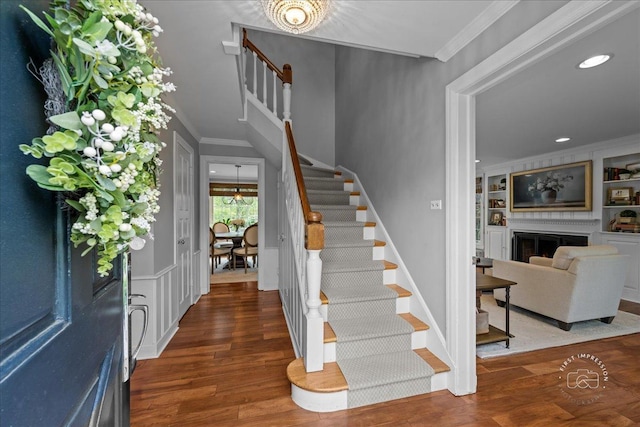 6N225 Circle Ave, Medinah, IL 60157 - entrance foyer with stairway, crown molding, wood finished floors, a fireplace, and recessed lighting