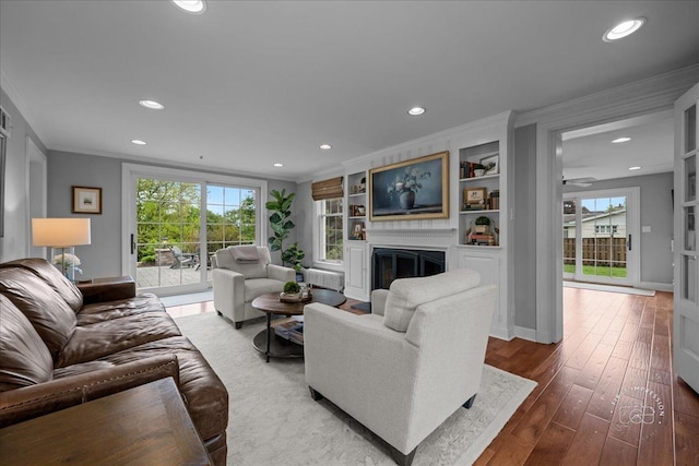6N225 Circle Ave, Medinah, IL 60157 - living room with crown molding, a fireplace, recessed lighting, healthy amount of natural light, and wood finished floors