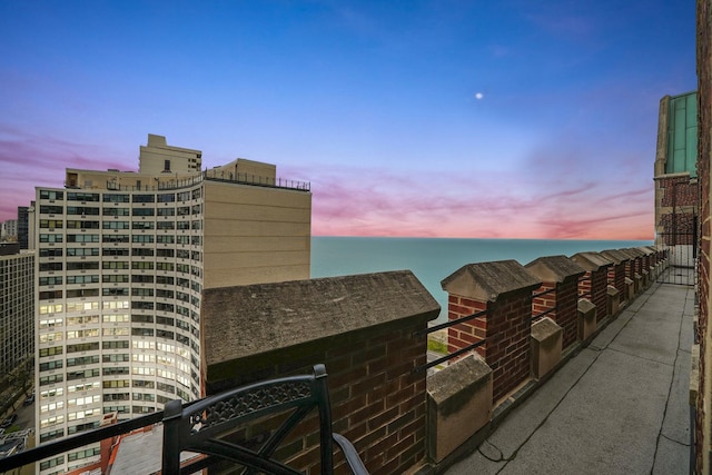 patio terrace at dusk with a water view