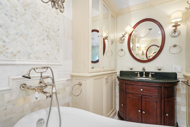full bathroom with vanity, a soaking tub, and ornamental molding