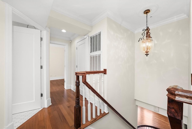 corridor with recessed lighting, an upstairs landing, crown molding, baseboards, and dark wood finished floors