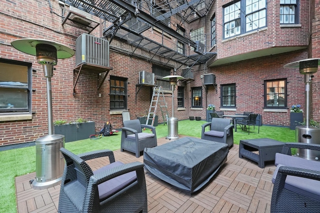 view of patio / terrace with central AC and outdoor lounge area