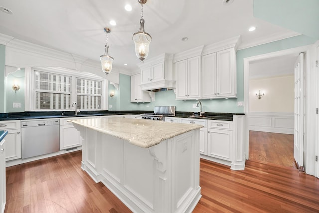 kitchen featuring dishwasher, ornamental molding, range, and a sink