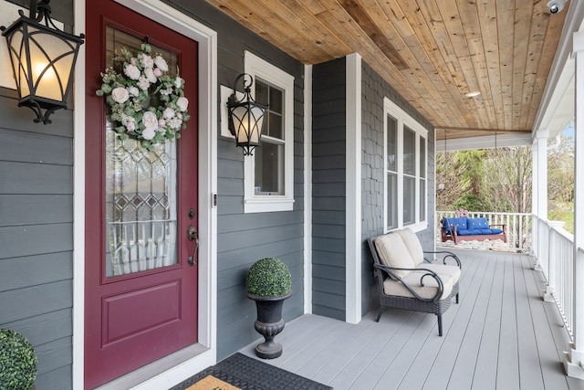 doorway to property featuring covered porch