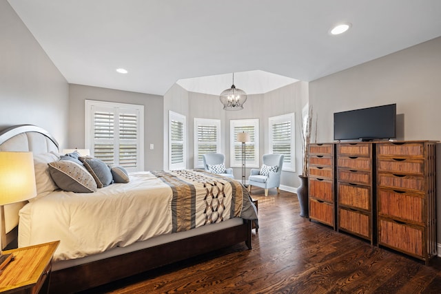 bedroom with a chandelier, wood finished floors, recessed lighting, and baseboards