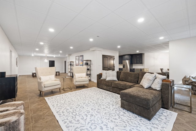 living room featuring recessed lighting and baseboards