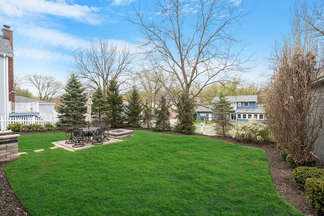 view of yard with a patio and a fire pit