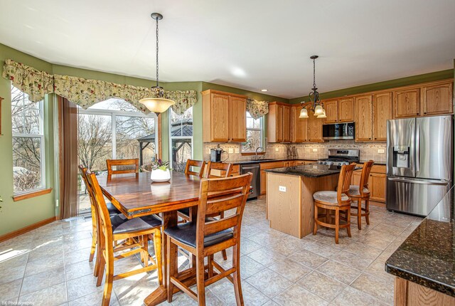 12941 Grande Poplar Cir, Plainfield, IL 60585 - dining area featuring baseboards and light tile patterned flooring