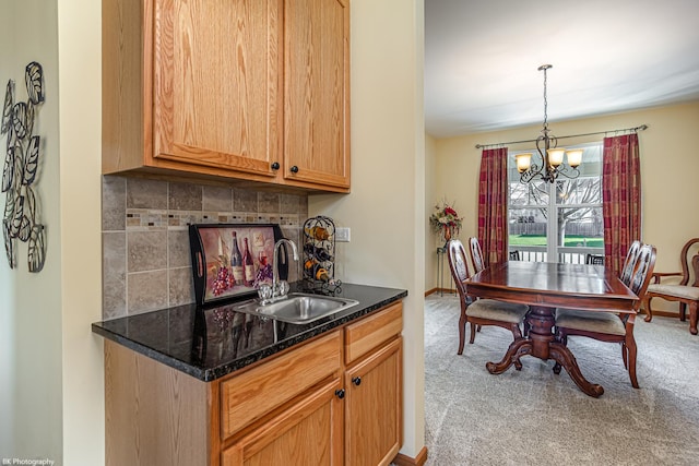 12941 Grande Poplar Cir, Plainfield, IL 60585 - dining area featuring a chandelier, baseboards, and carpet floors