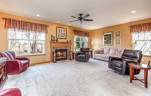 12941 Grande Poplar Cir, Plainfield, IL 60585 - carpeted living room with a stone fireplace, a ceiling fan, and recessed lighting