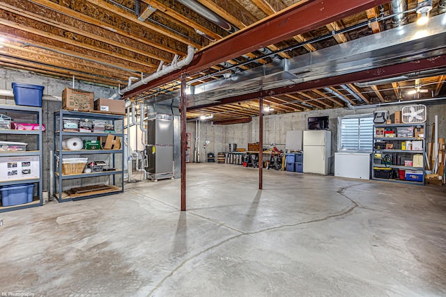 12941 Grande Poplar Cir, Plainfield, IL 60585 - basement featuring heating unit and freestanding refrigerator