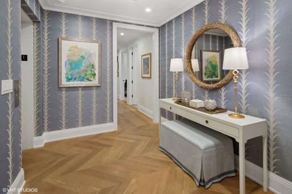 hallway featuring baseboards, wallpapered walls, and recessed lighting