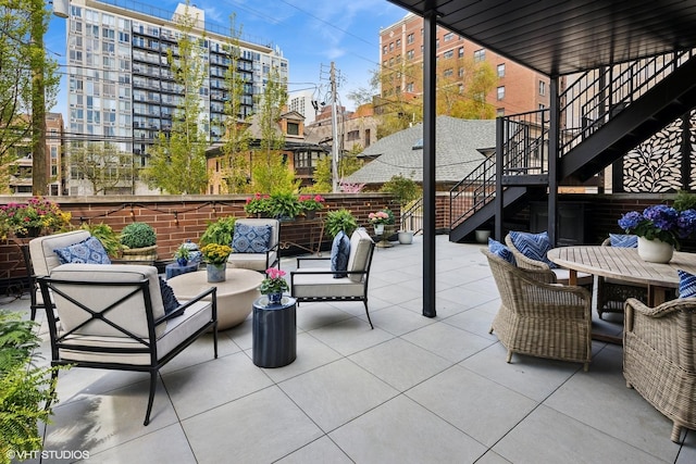 454 W Barry Ave Unit 1, Chicago, IL 60657 - view of patio / terrace with stairway, outdoor lounge area, and outdoor dining space