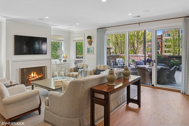454 W Barry Ave Unit 1, Chicago, IL 60657 - living room featuring a lit fireplace, wood finished floors, crown molding, and recessed lighting
