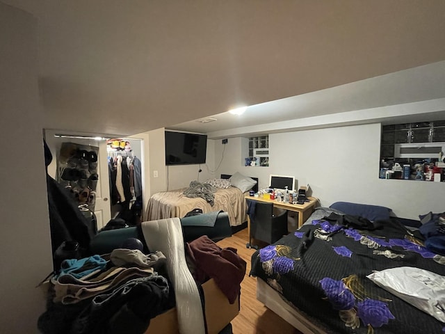bedroom featuring a closet and wood finished floors