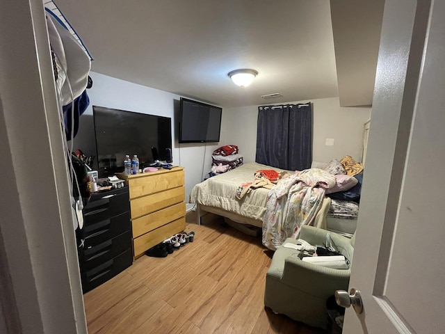 bedroom featuring light wood finished floors