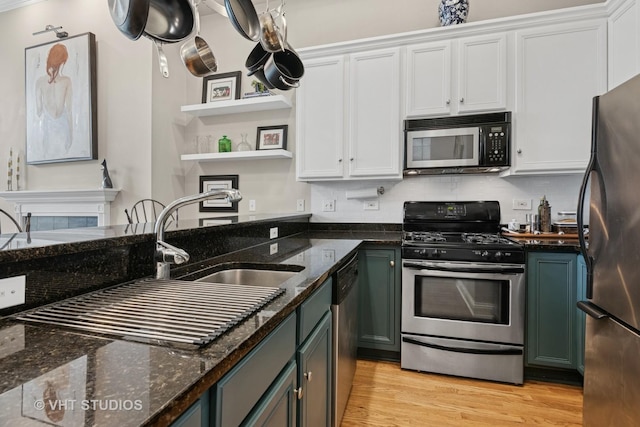 2512 W Thomas St Unit 3, Chicago, IL 60622 - kitchen featuring white cabinets, open shelves, a sink, stainless steel appliances, and light wood-type flooring