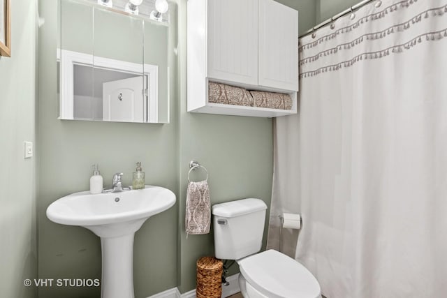 2512 W Thomas St Unit 3, Chicago, IL 60622 - bathroom with a sink, toilet, and a shower with shower curtain