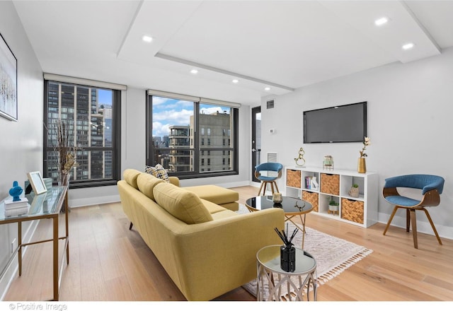 1030 N State St Unit 21K, Chicago, IL 60610 - living area with recessed lighting, visible vents, light wood-style flooring, and baseboards
